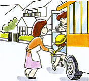 子どもを幼稚園の送迎バスに送る